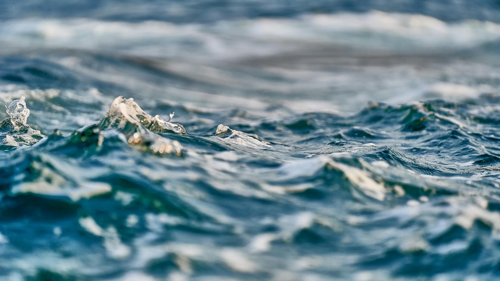 Choppy blue green water in close up